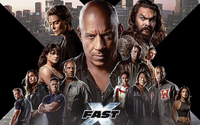 Promotional poster for Fast X, featuring Vin Diesel at the center with a diverse cast, including Jason Momoa and Charlize Theron, set against a city skyline.