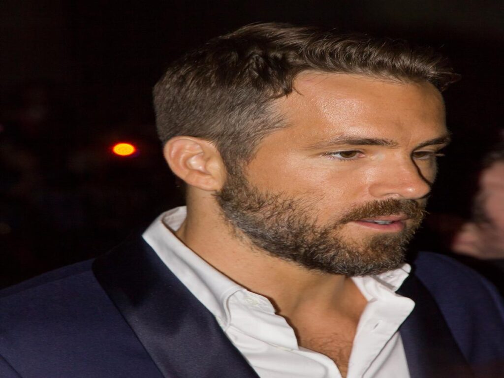 Ryan Reynolds at the premiere of The Voices in 2014, showcasing a close-up of his face with a beard.