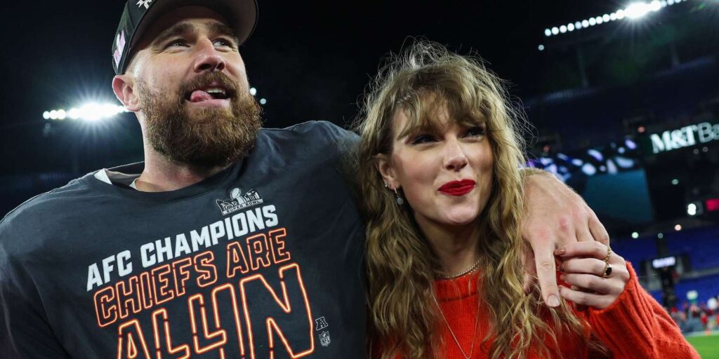 Taylor Swift and Travis Kelce celebrate together after the AFC Championship game, with Travis wearing a champions shirt and Taylor in a cozy red sweater.