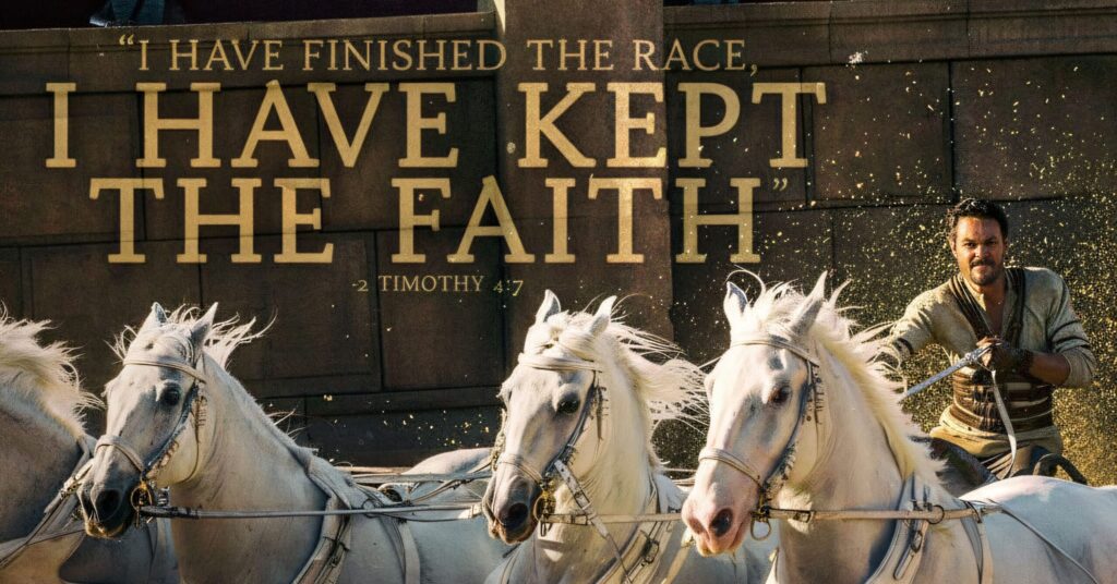 A dramatic scene of four white horses pulling a chariot across an arena with a driver behind them and bold text above.