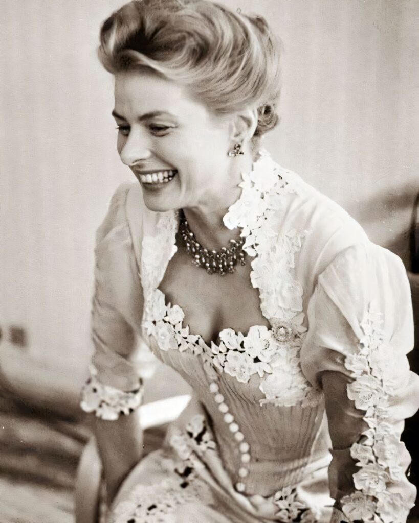 A high-contrast black and white close-up portrait of Ingrid Bergman looking thoughtfully into the distance.