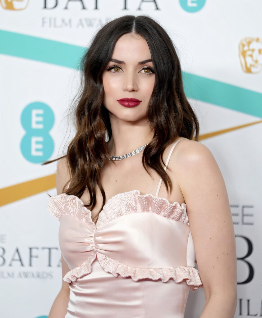 Close-up of Ana de Armas wearing a pale pink satin dress with ruffled detailing and a diamond necklace at the BAFTA awards.